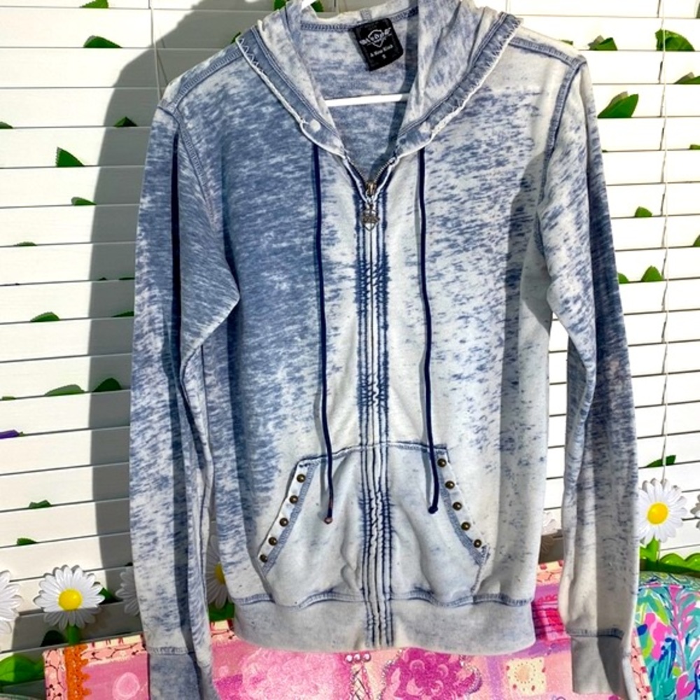 Sledge hoodie with silver sparkly fleur-de-lis pattern on back